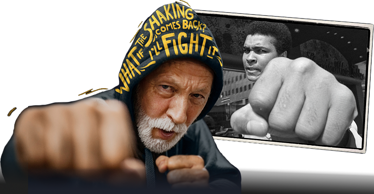 A man dressed in a hoodie punches towards the camera. The text on his hood reads "What if the shaking comes back? I'll fight it."